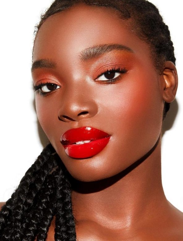 A glossy red lip