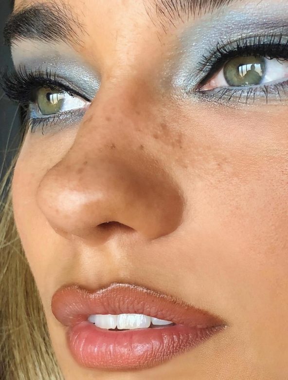 Model wearing frosted blue eyeshadow