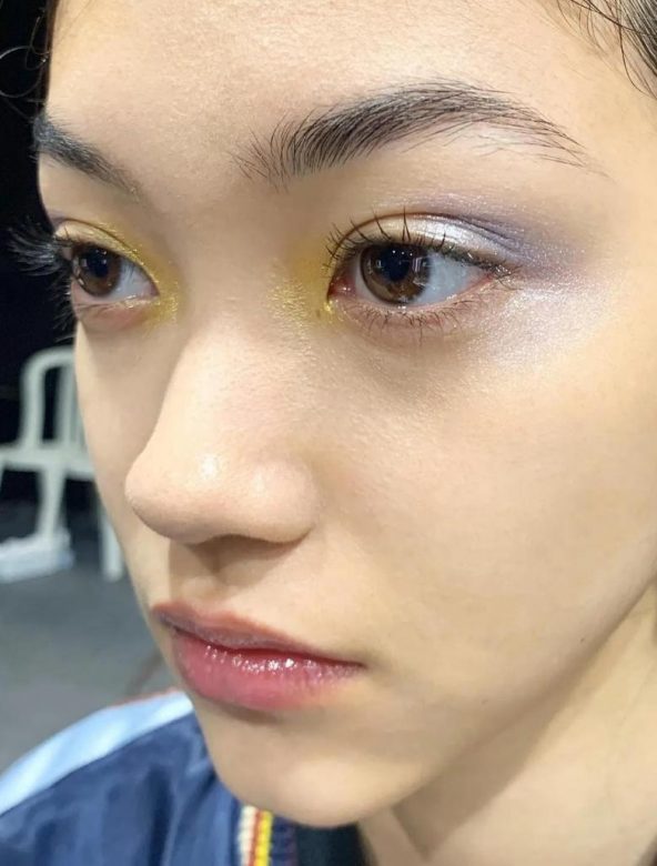 pastel yellow and lilac eyeshadow on a model