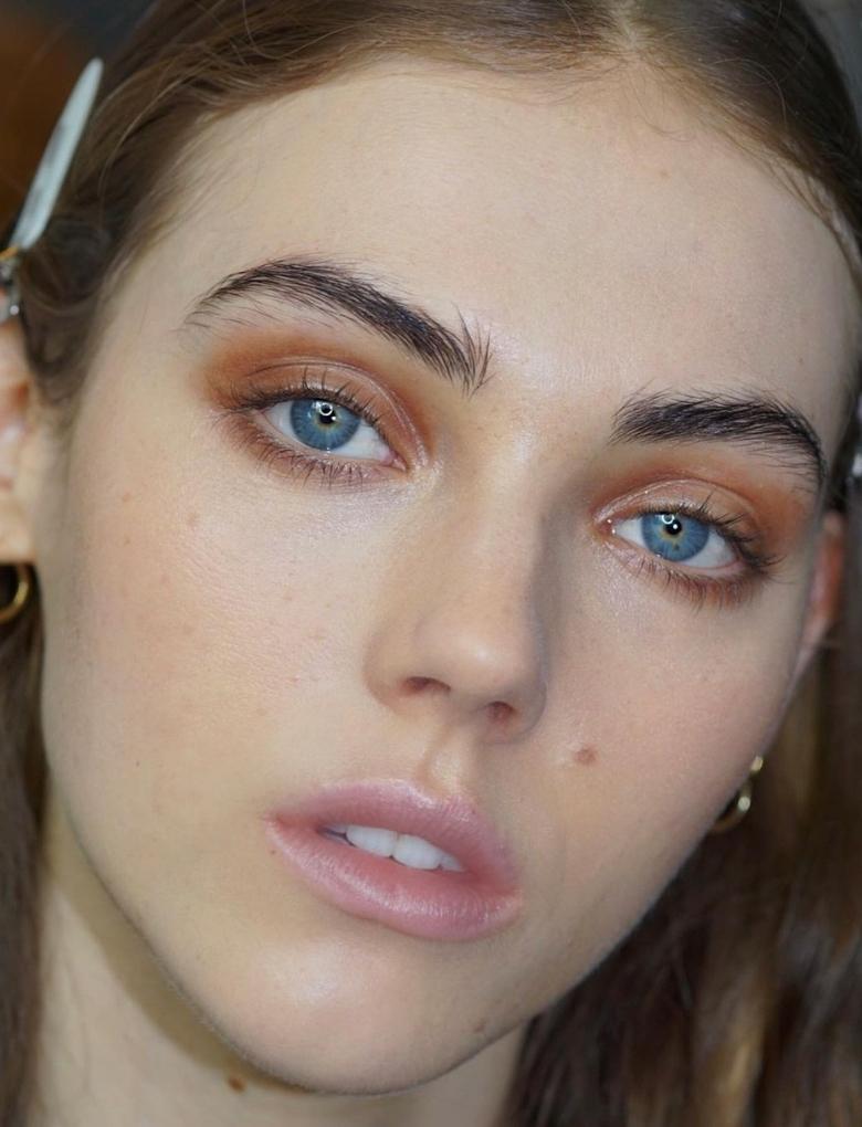 brown eyeshadow on a model with blue eyes