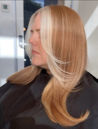 long hair strawberry blonde model bleached curtain bangs